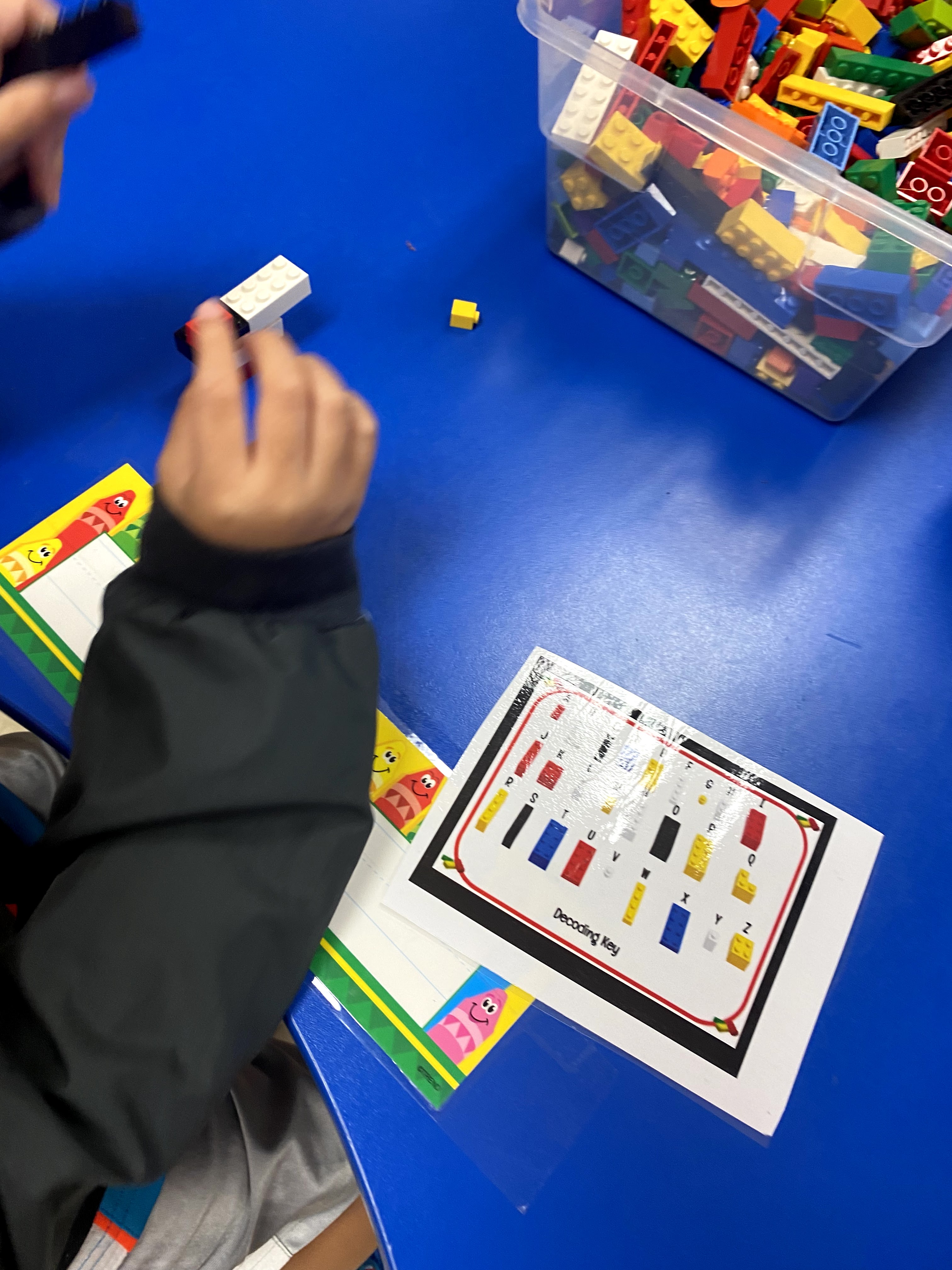 Students playing with Legos