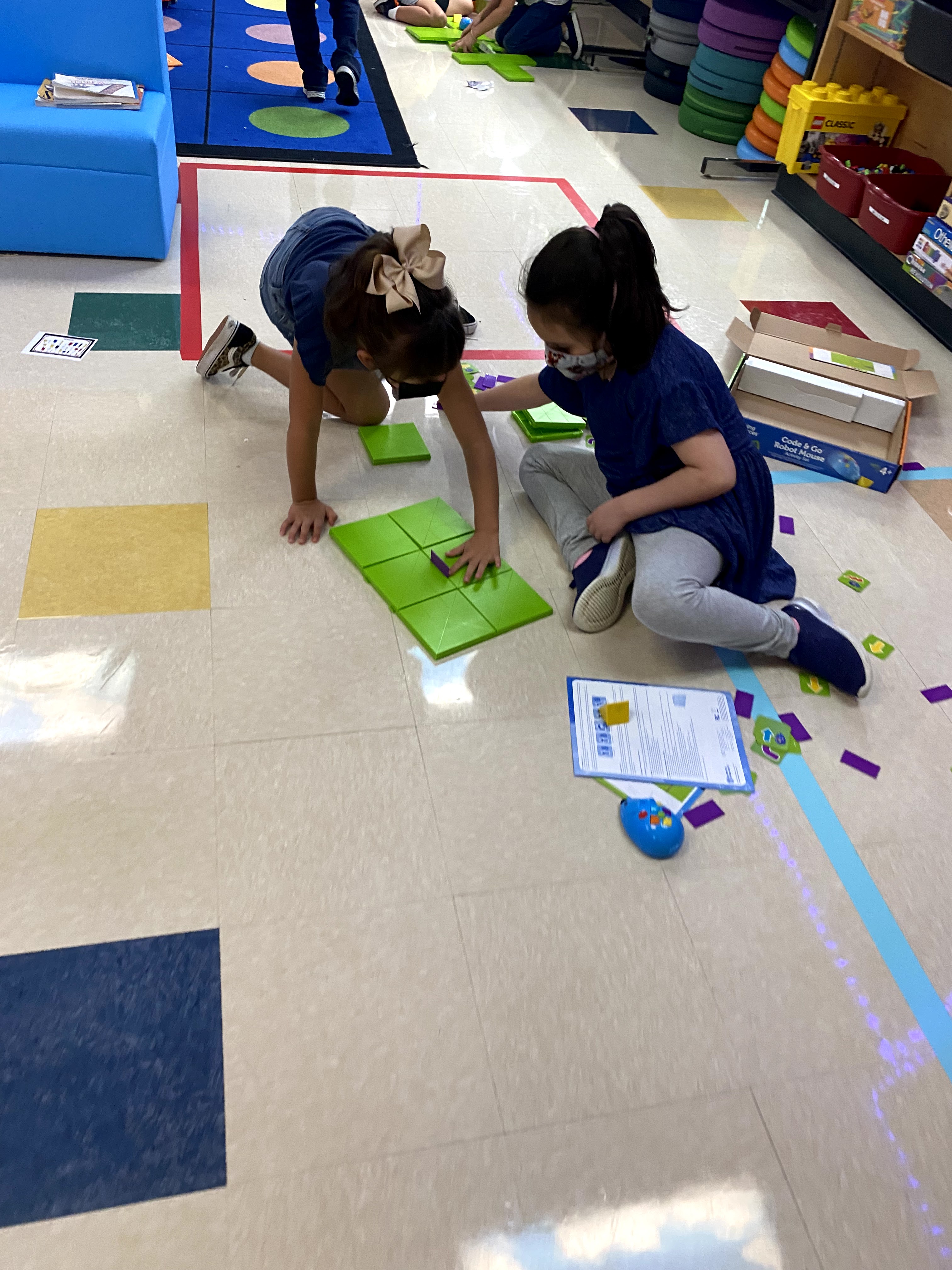 Students playing with Legos