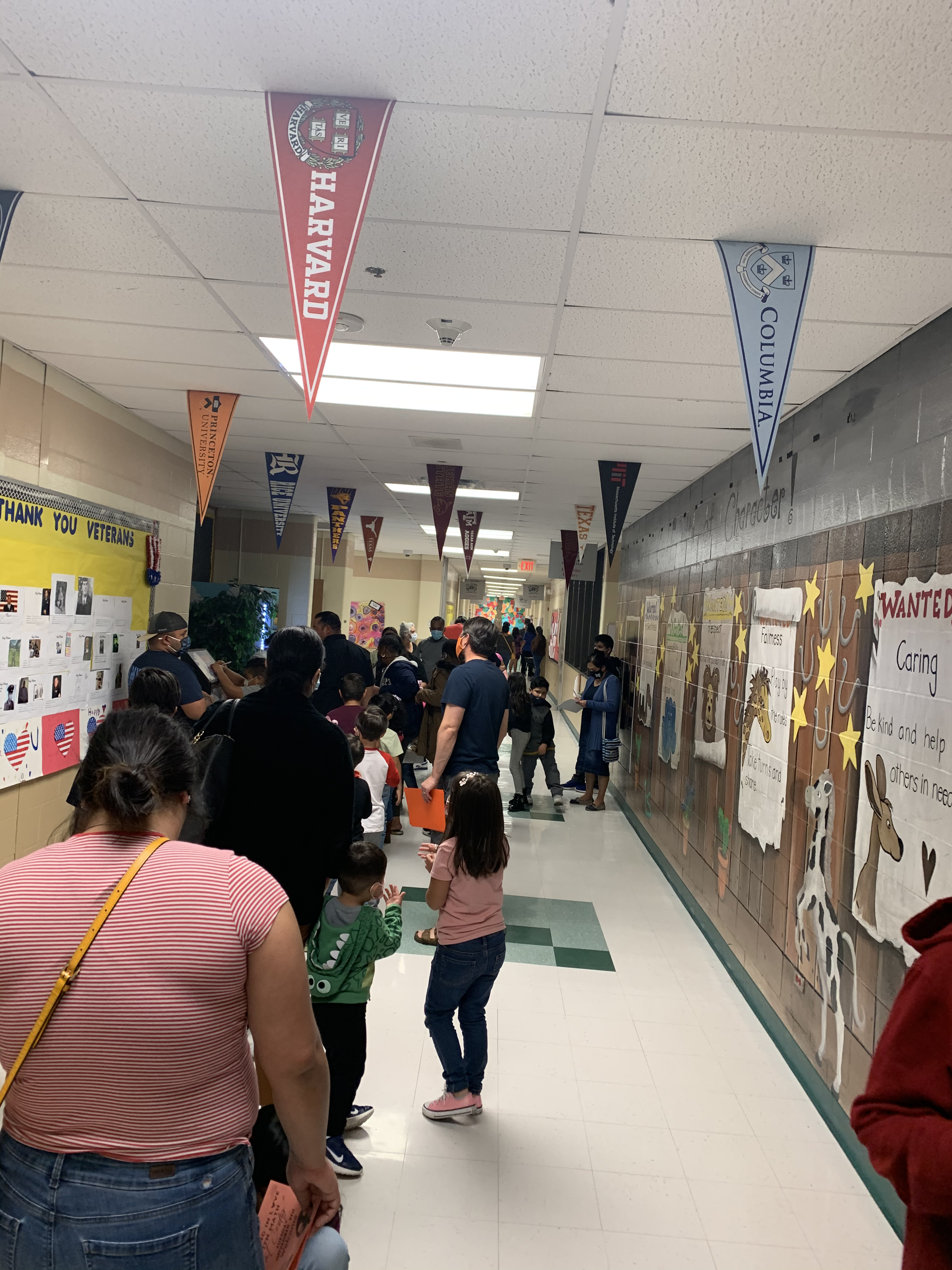 Families lined up to enter cafeteria.