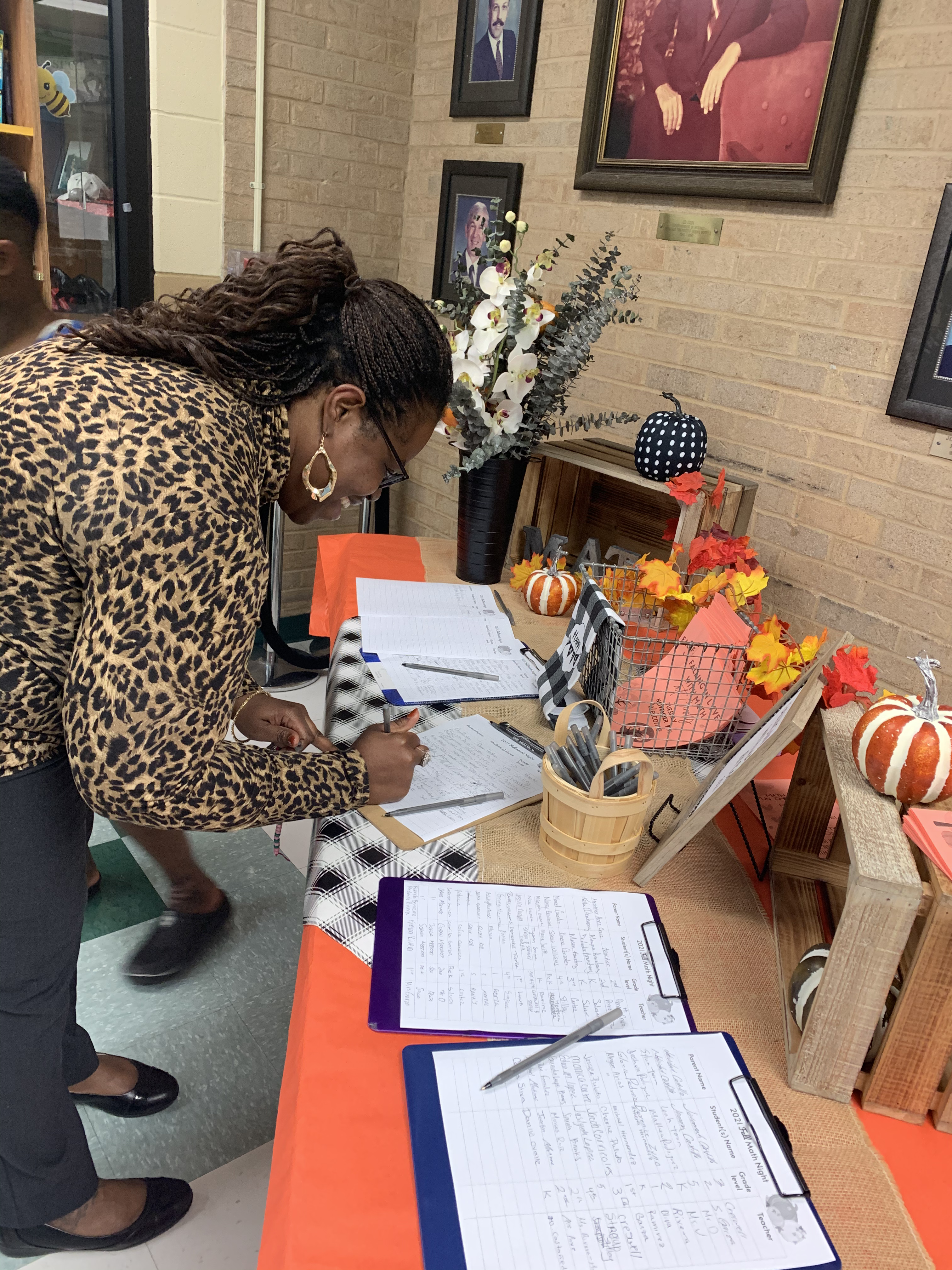 African American female signing into Math Night.