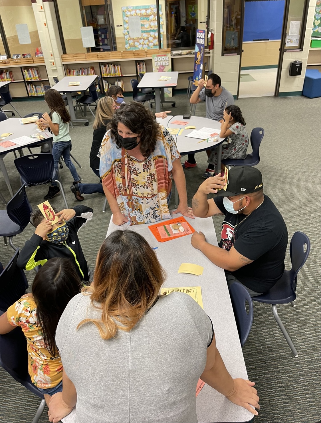 Cody teacher playing Math game with two parents and two students.