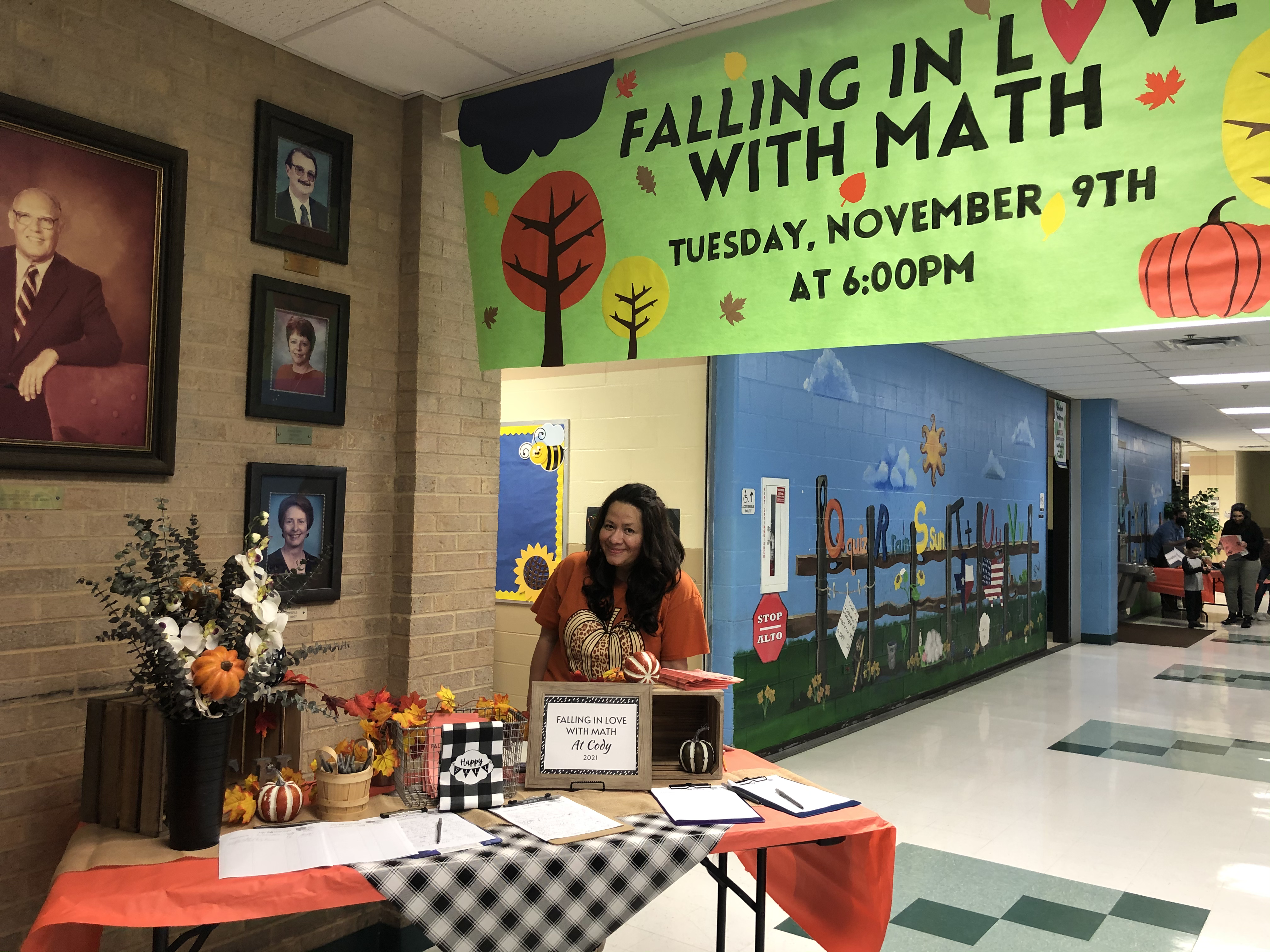 Female Math Specialist standing at entry of Math Night.