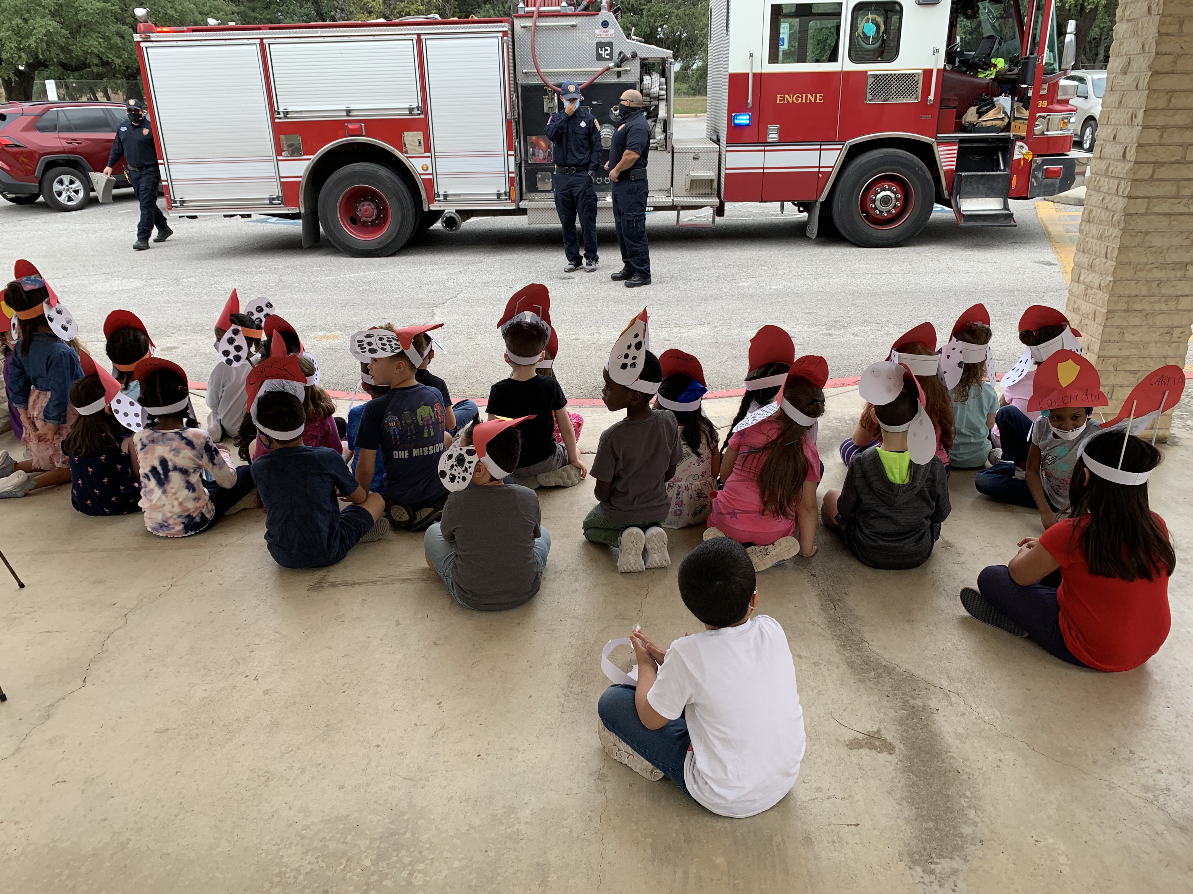 Students looking at a firetruck.
