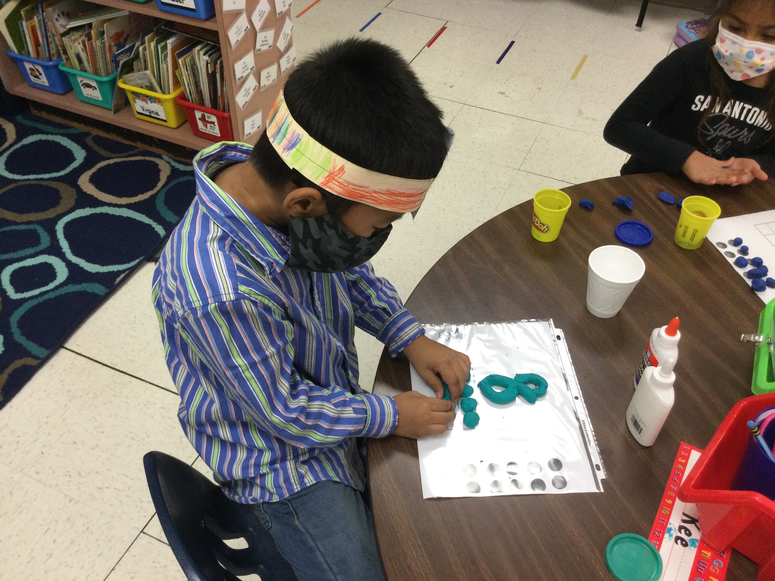 Students playing with clay.
