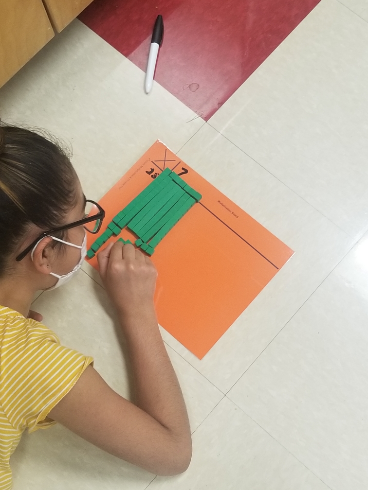 Student working on math problem.