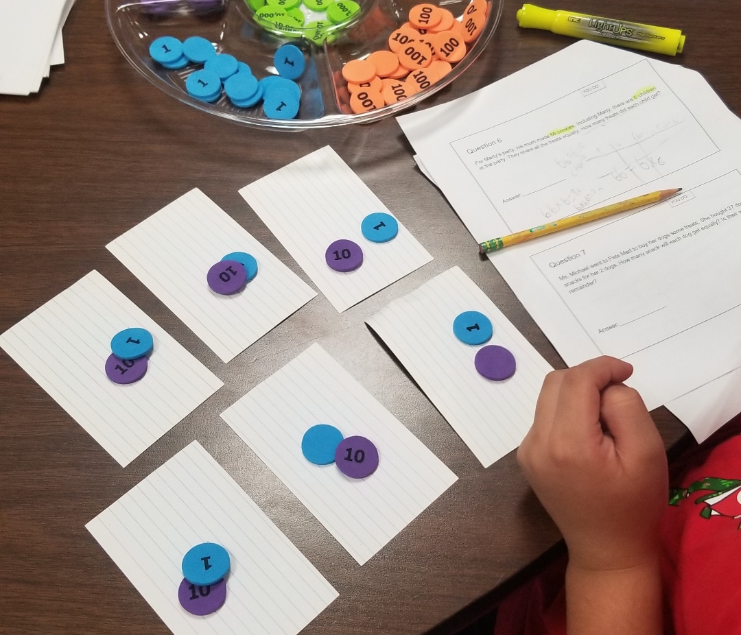 Student working on a math problem. 