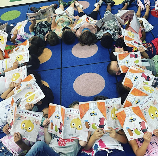 Students lying in a circle.