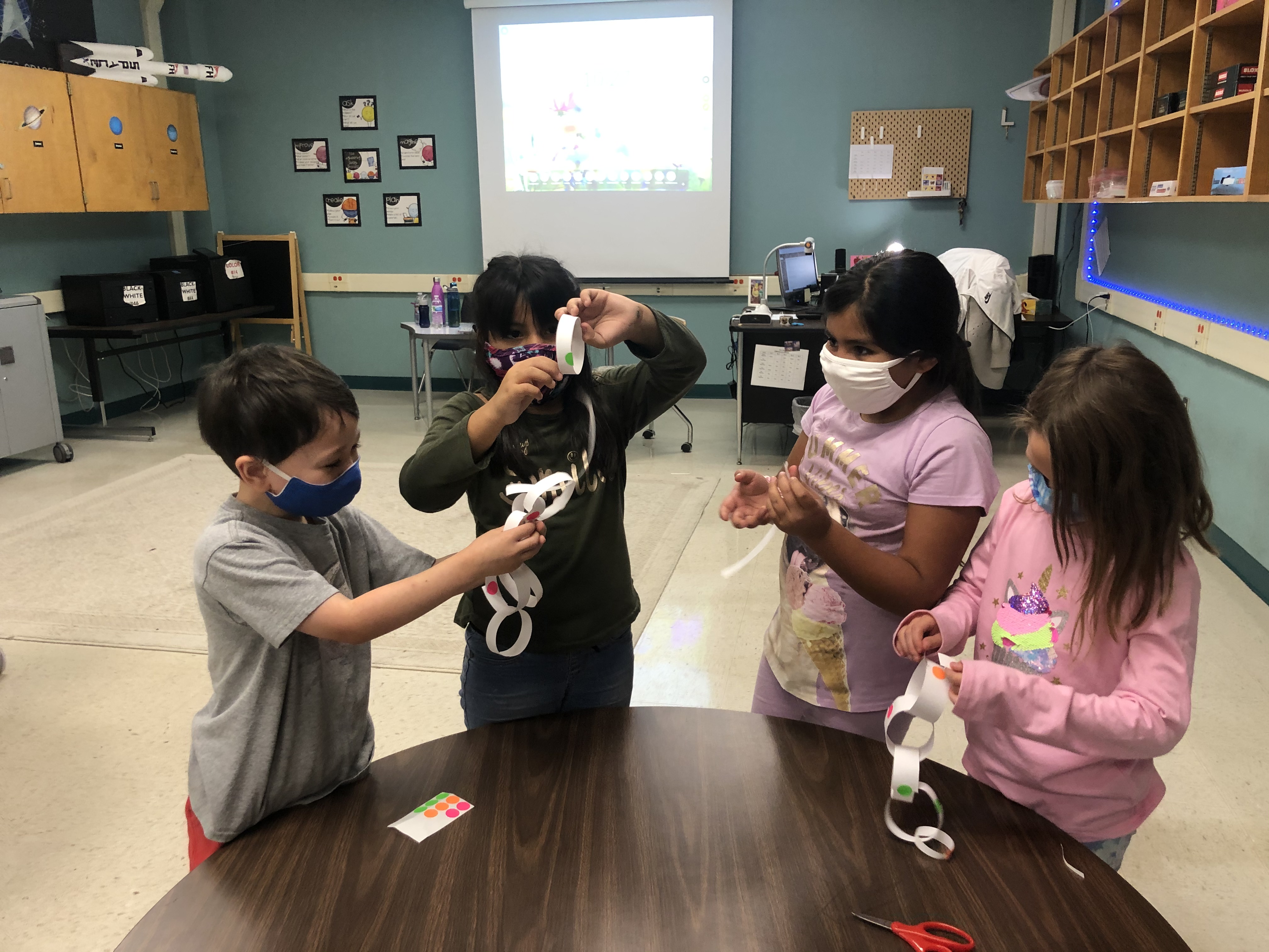 Four students working on a chain project.