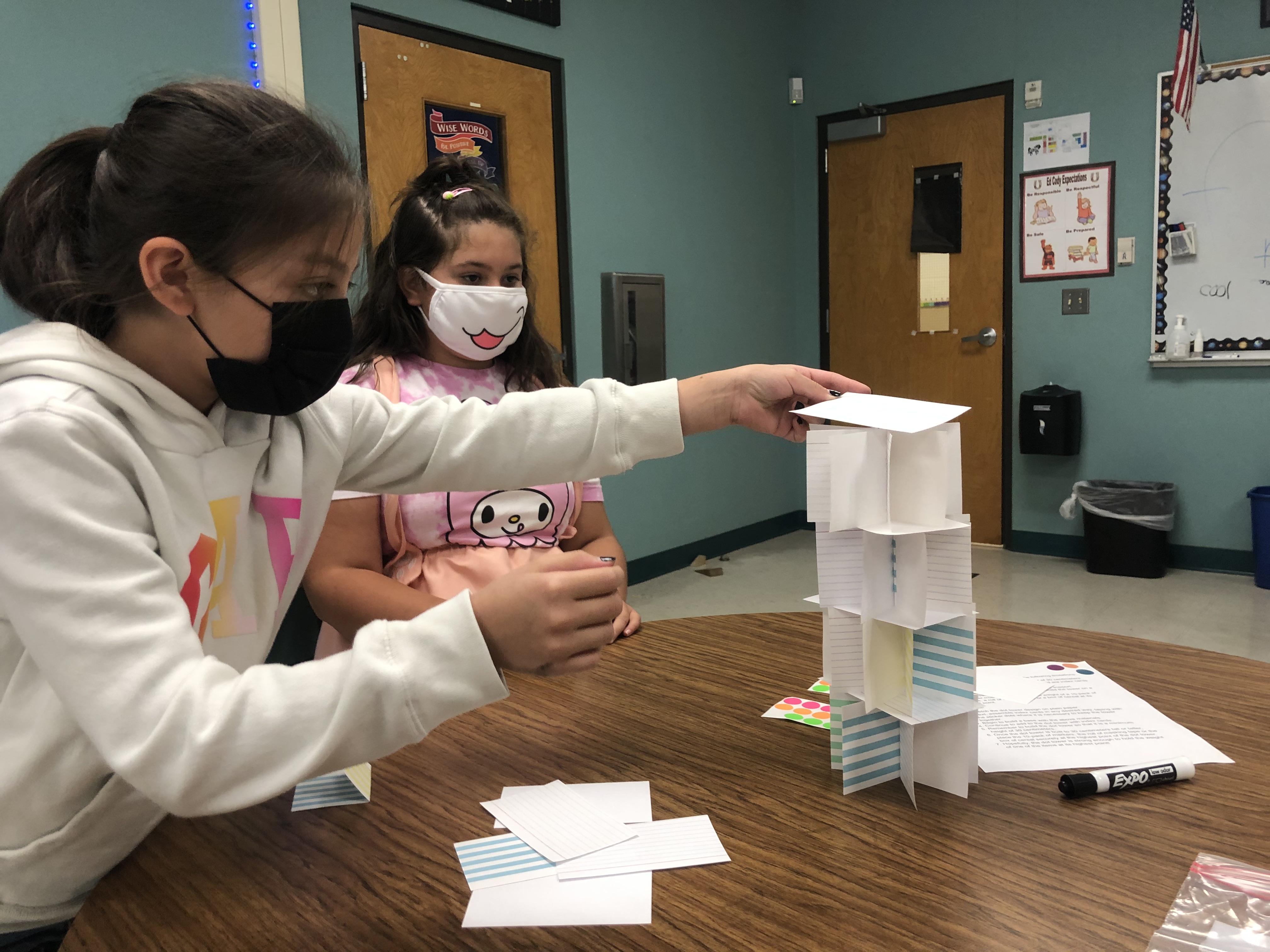 Two girls building a project.