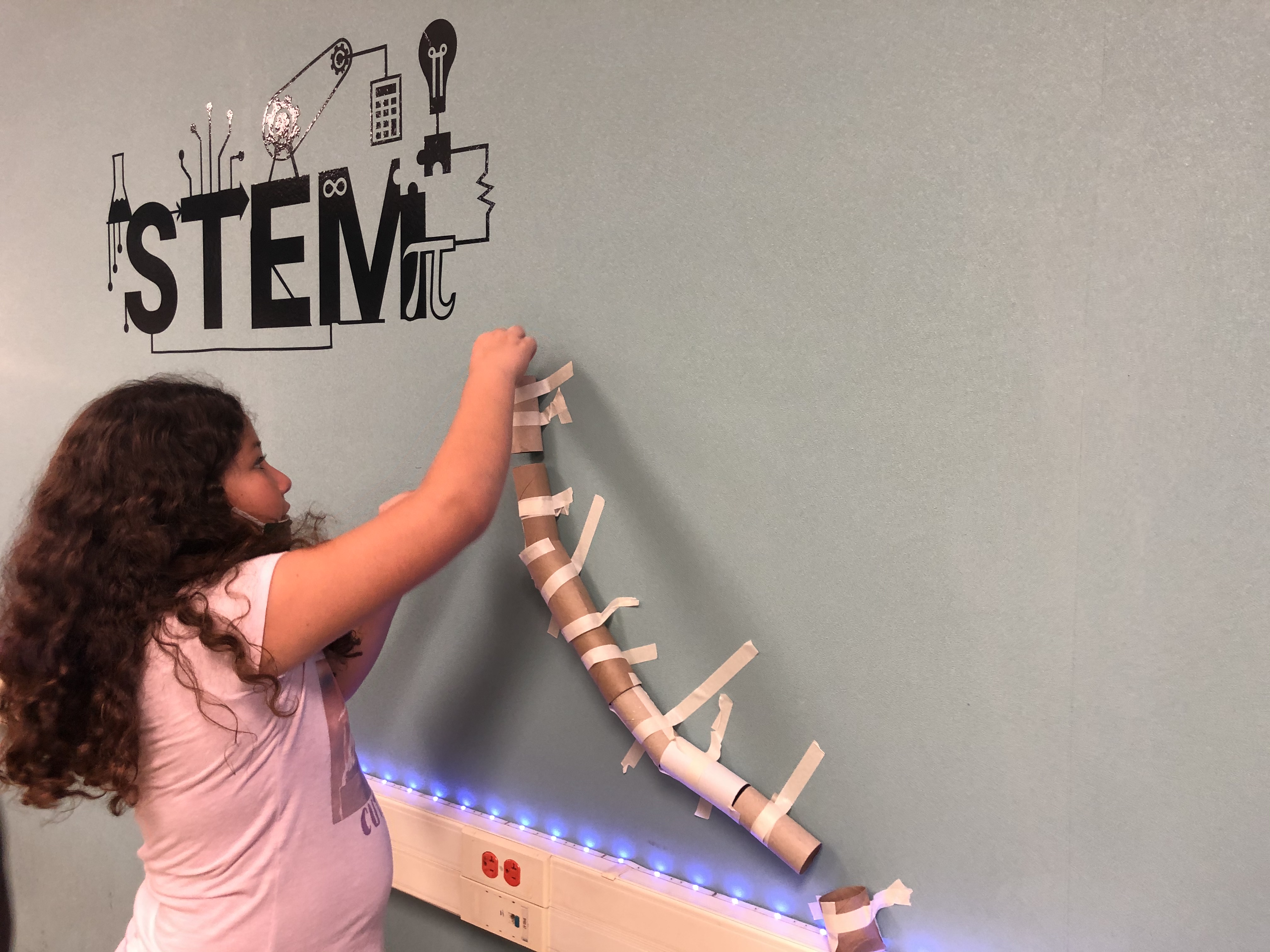 Girl working on gravity project.