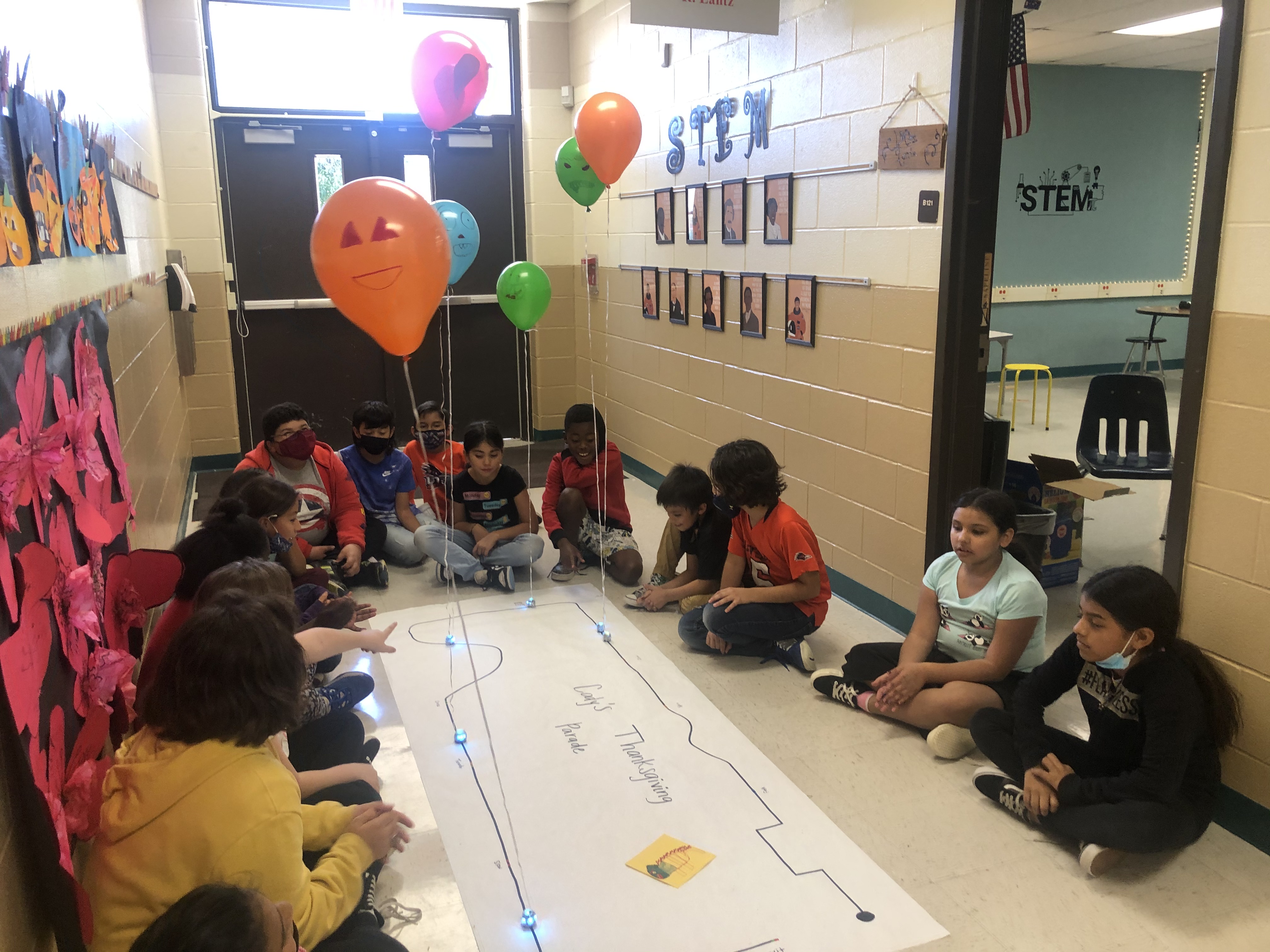 STEM class viewing a project.