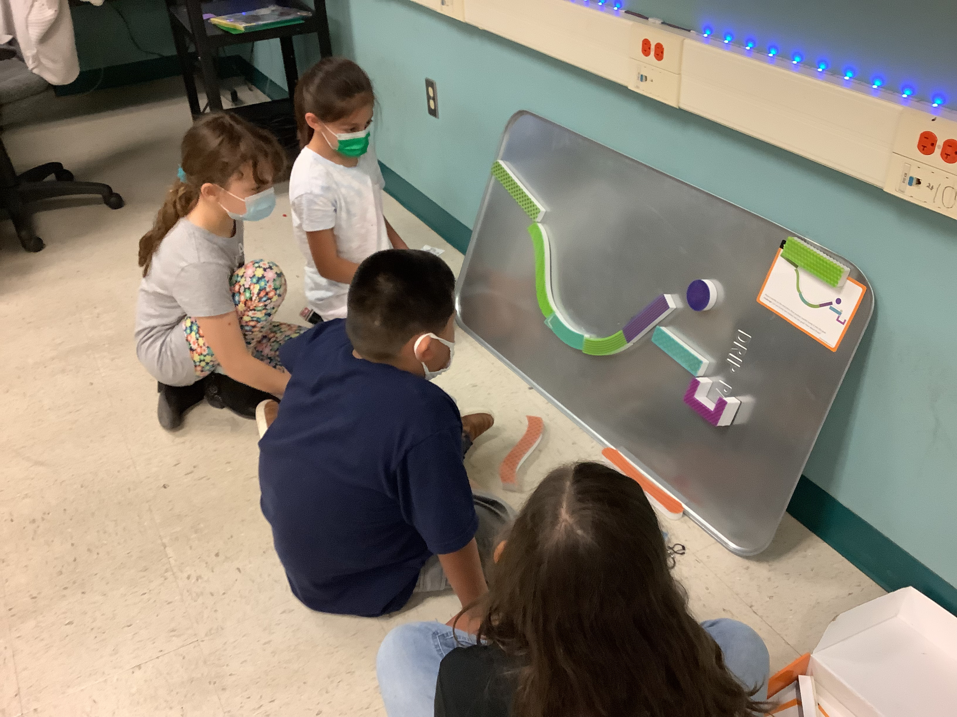 Four students working on a STEM project.