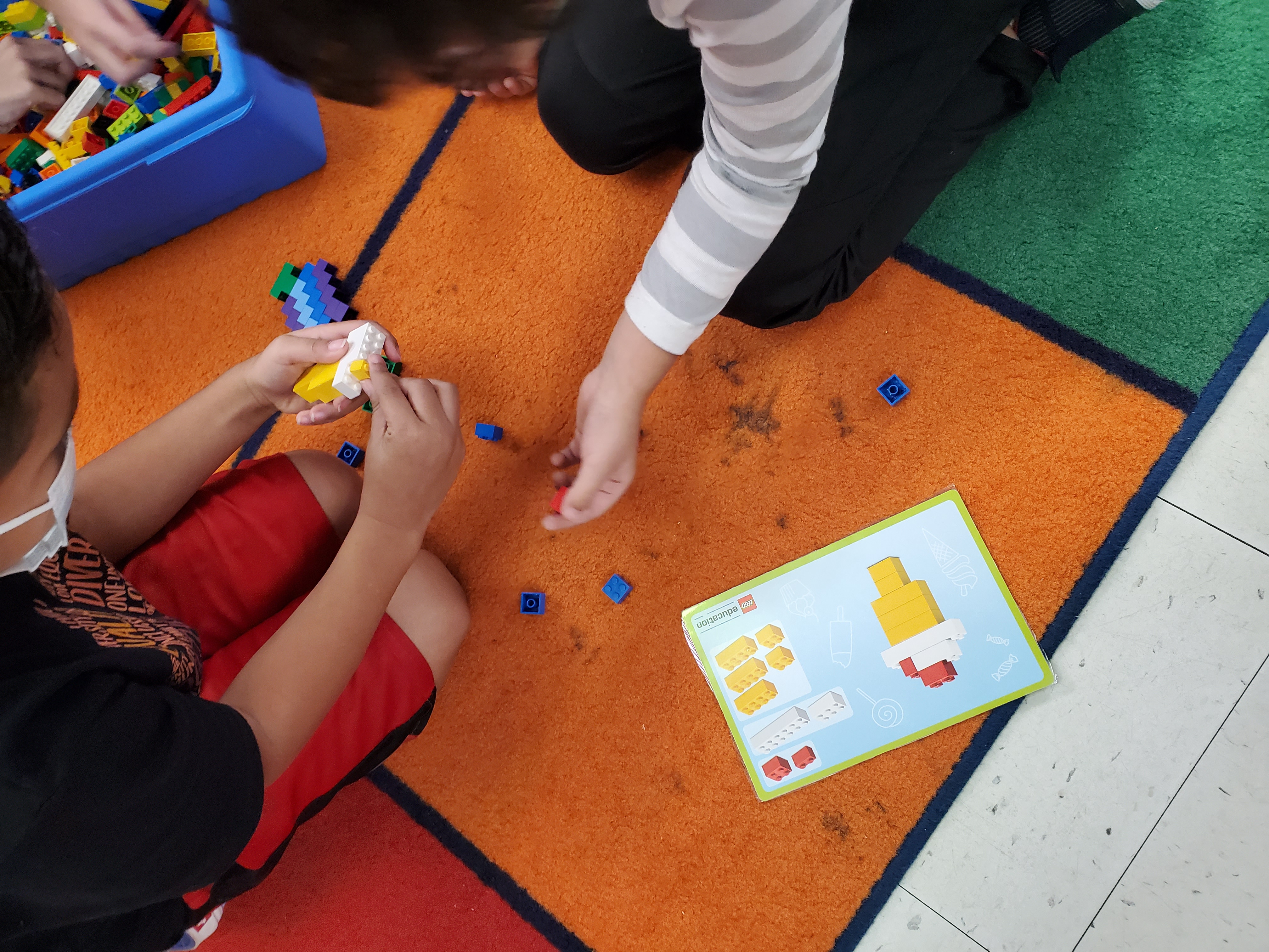 Students playing with Legos