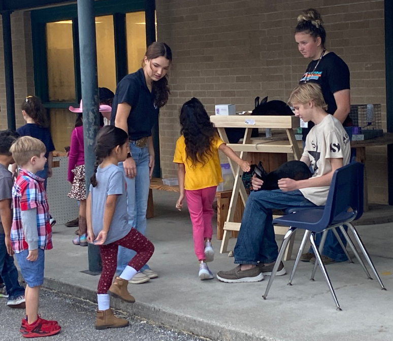 Helotes Bulldogs learning about animal care from O'Connor High School Students