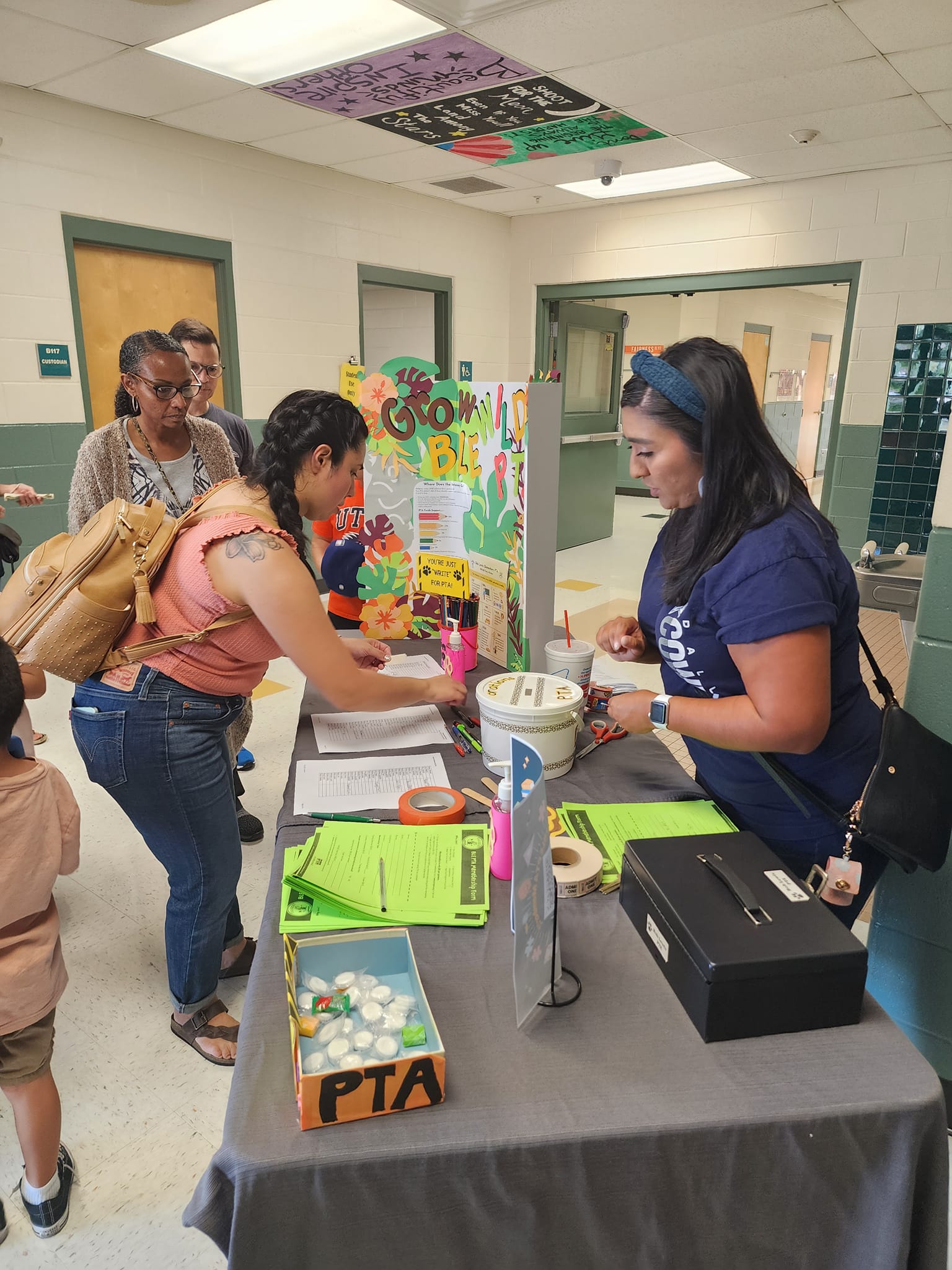 PTA signing in parents to the event.