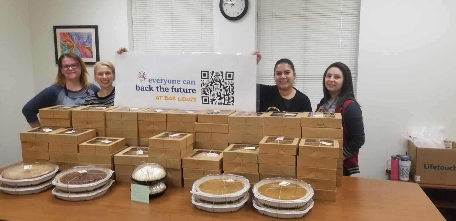 The PTA members with Thanksgiving pies for the staff.