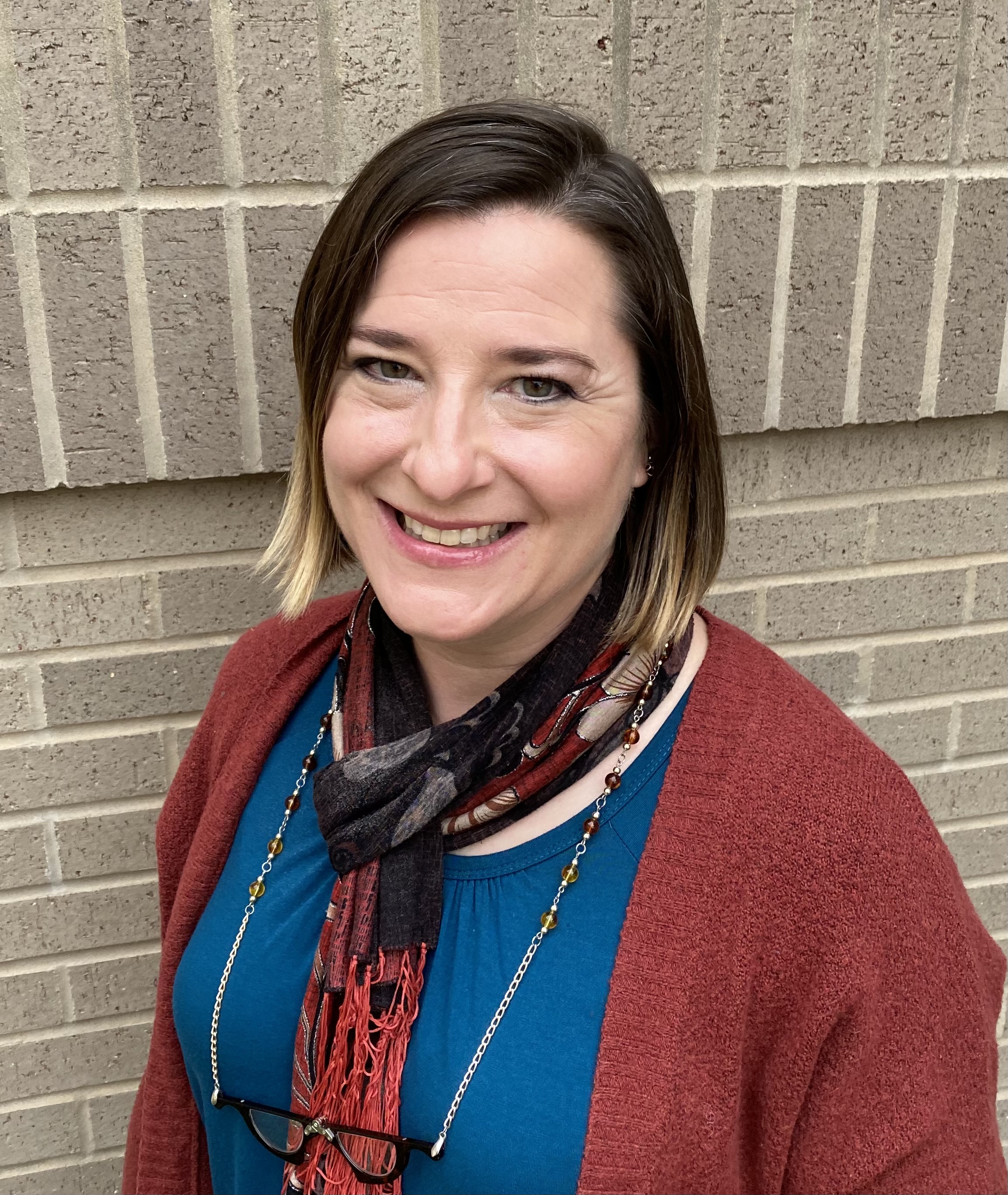 librarian vanessa eichler posed near brick background