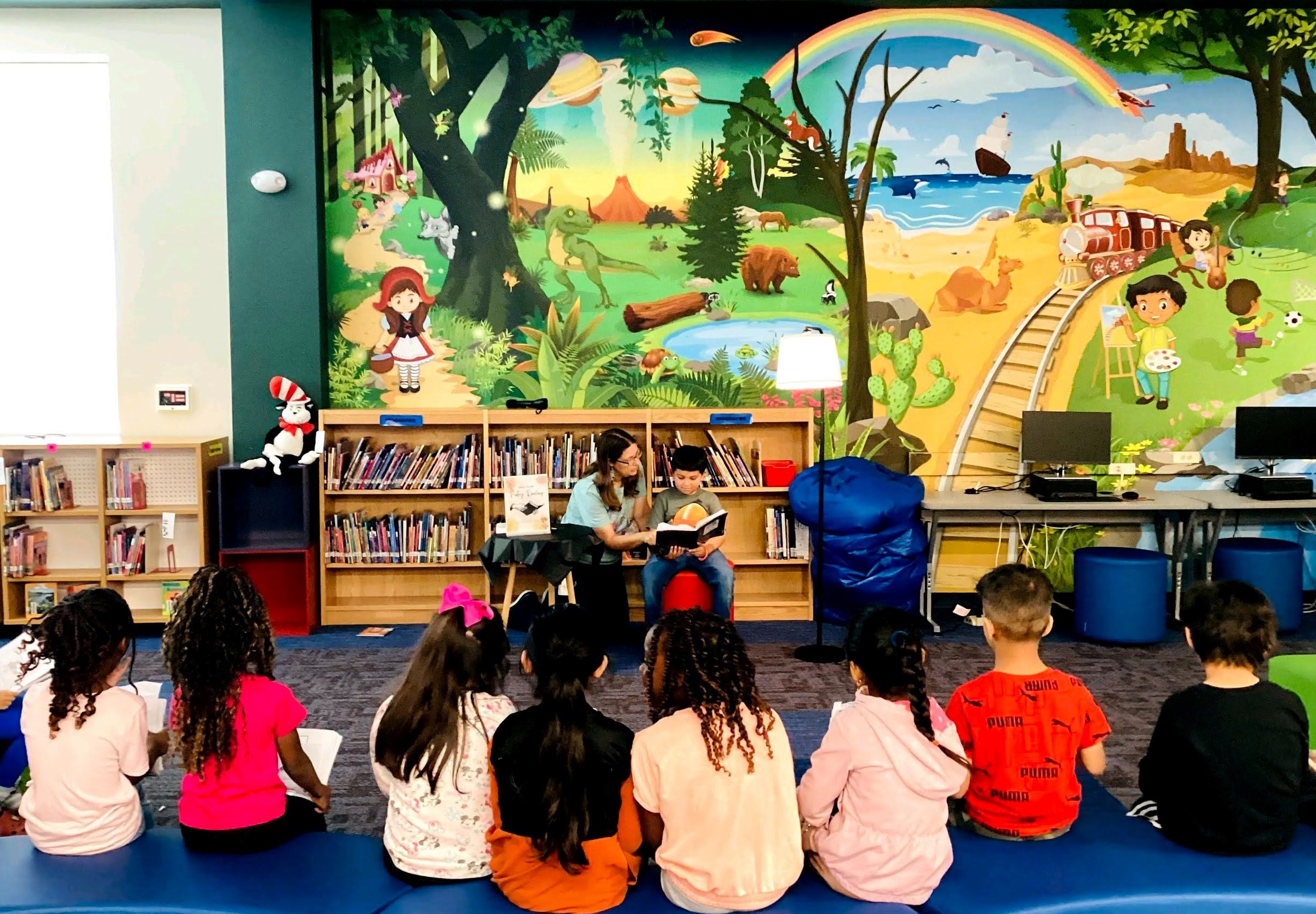 group of students watching teacher and student