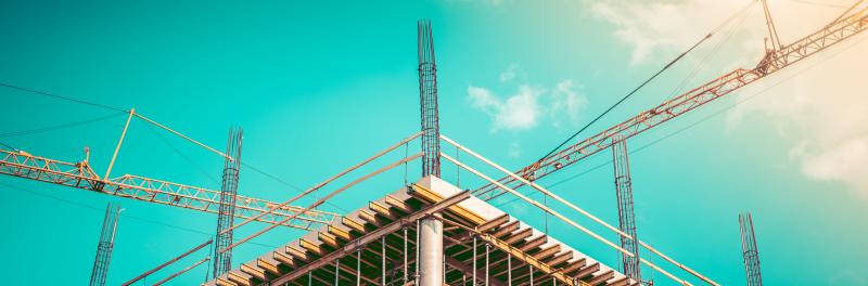 Construction men working on building