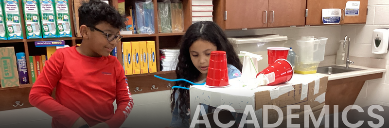Students building cardboard models