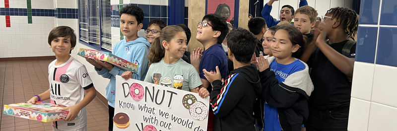 Group of Students Walking With Banner