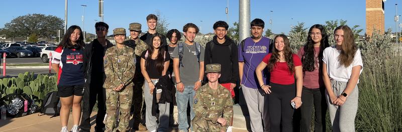 Students attending morning prayer at the flagpole