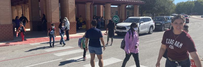 patrols helping at the crosswalk in the front of the school