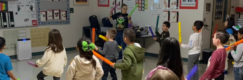 Ms. Talley instructs with Percussion Tubes