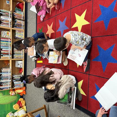 Students reading on the carpet