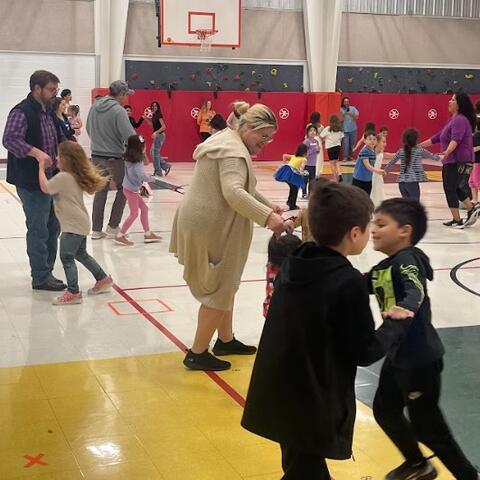 Parents and students playing