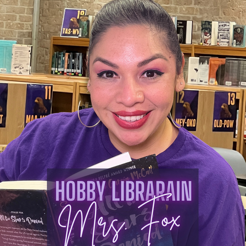 female librarian reading a book