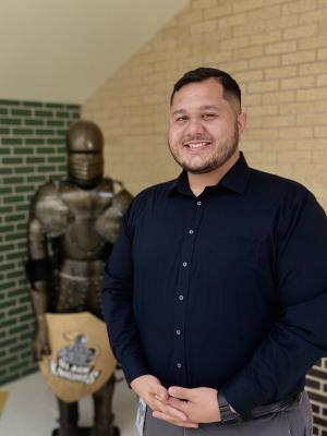 Associate Principal David La Boy in front of Black Knight