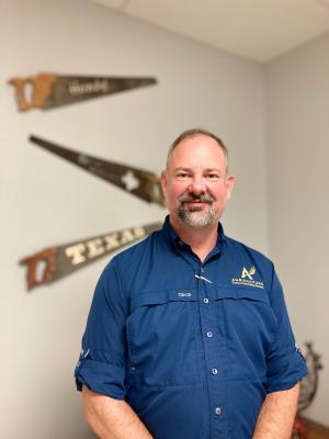 Mr. Hawkins in a blue shirt.