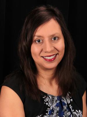 Portrait picture of Principal Lou Medina