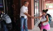 Dad greeting a student